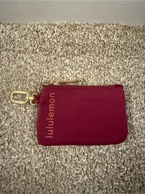lululemon athletica burgundy zip key pouch with gold hardware